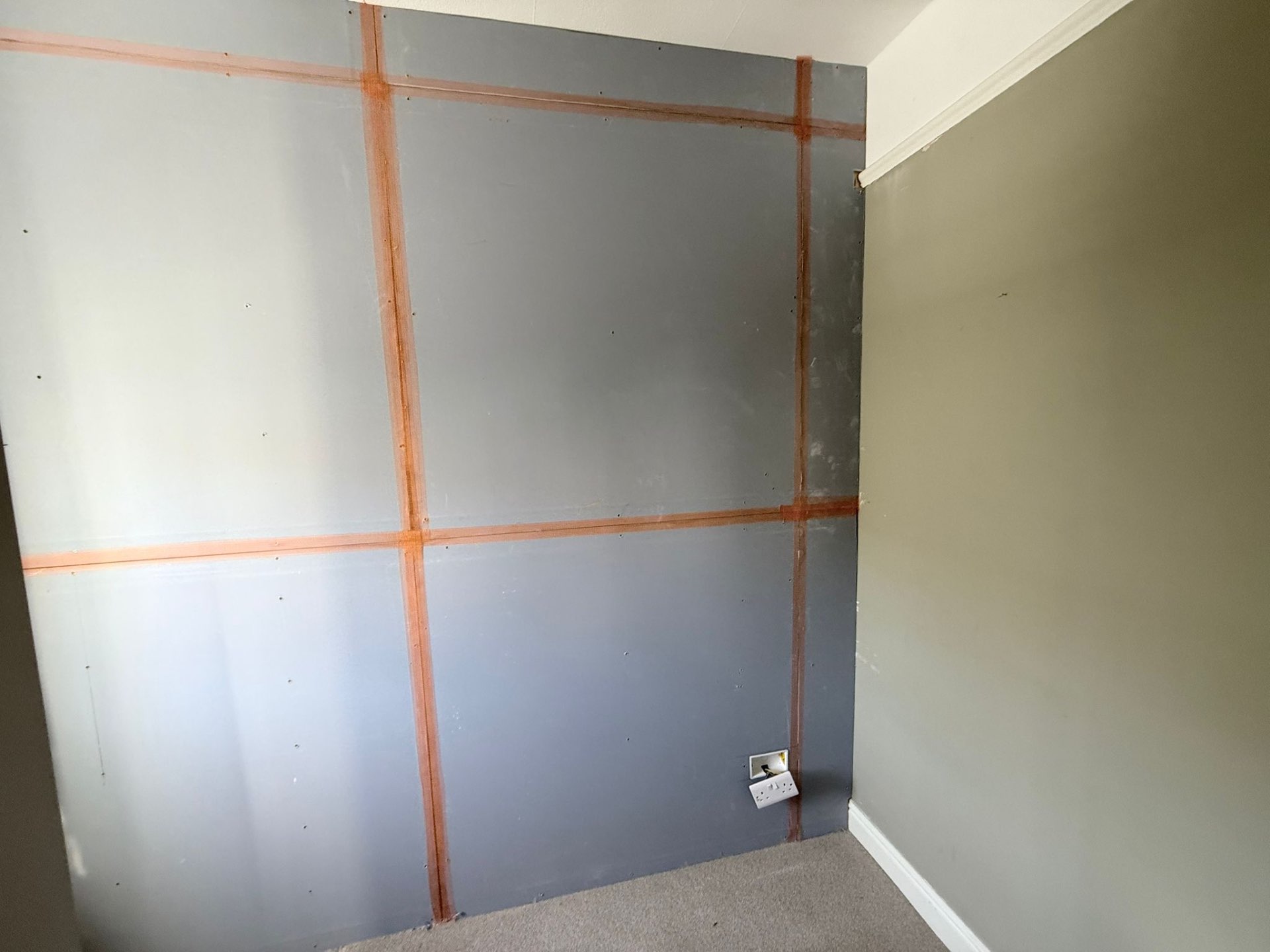 Acoustic soundproofing boards installed on bedroom party wall in Roundhay LS17