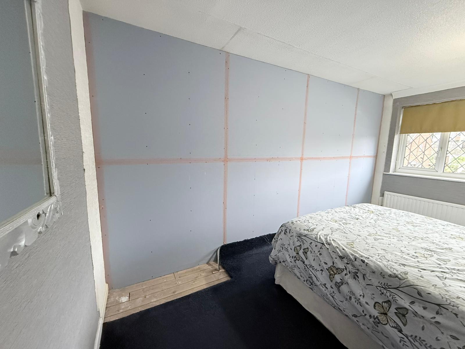 Finished soundproof wall against party wall in bedroom — Rothwell LS26
