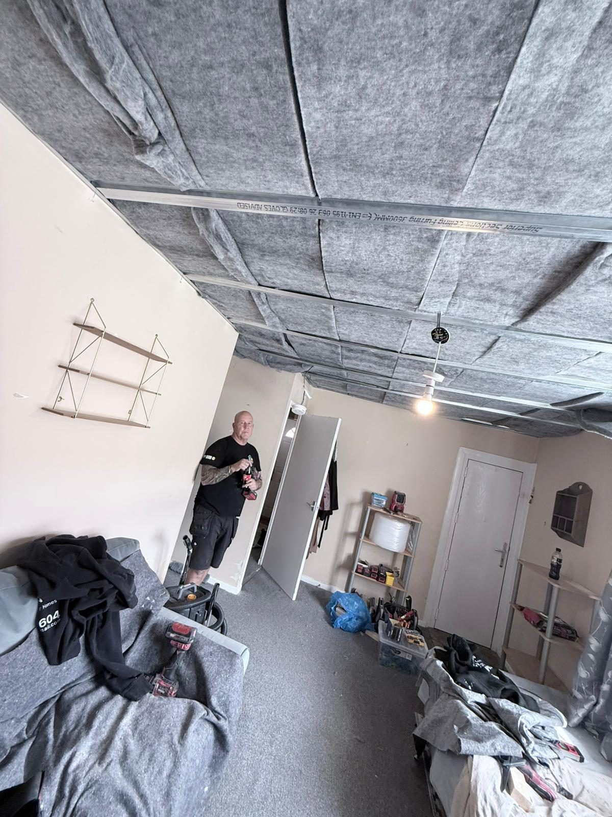 Acoustic mineral wool slabs fitted into suspended metal furring grid ceiling — Newlands, Morley LS27