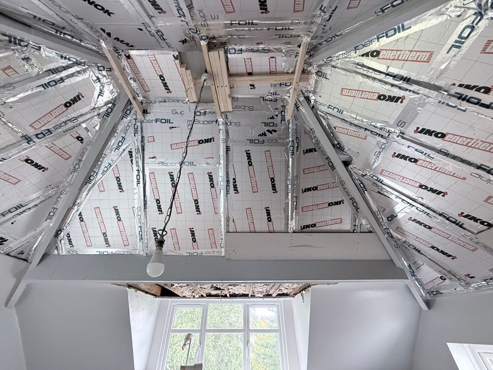 Full vaulted ceiling lined with foil-faced PIR insulation and SuperFOIL multifoil between rafters in Far Headingley LS16