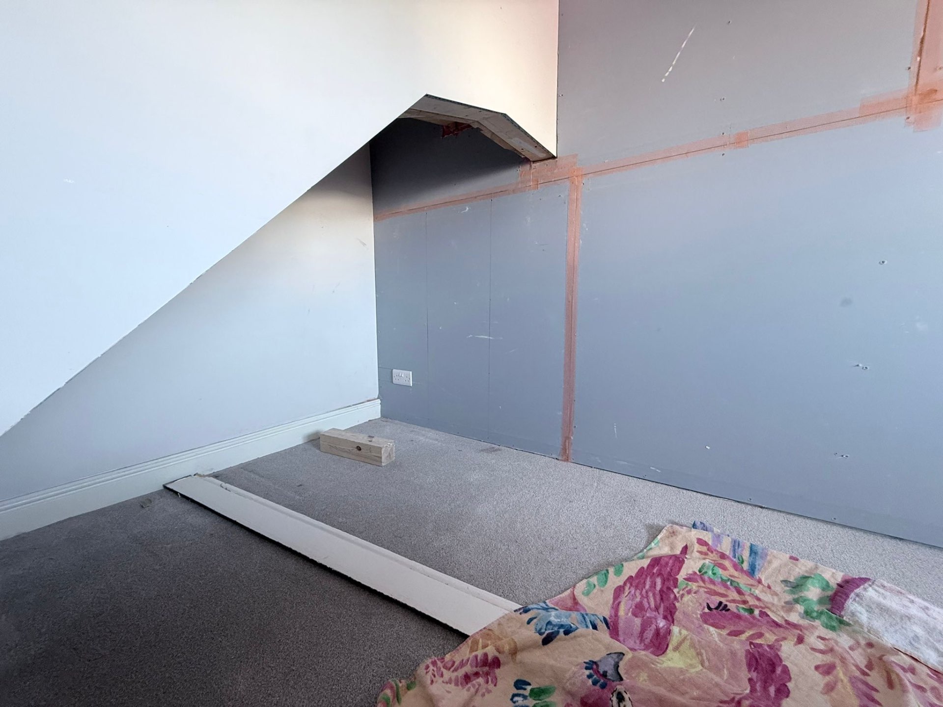 Detailed soundproofing around stair bulkhead in Roundhay LS17 bedroom
