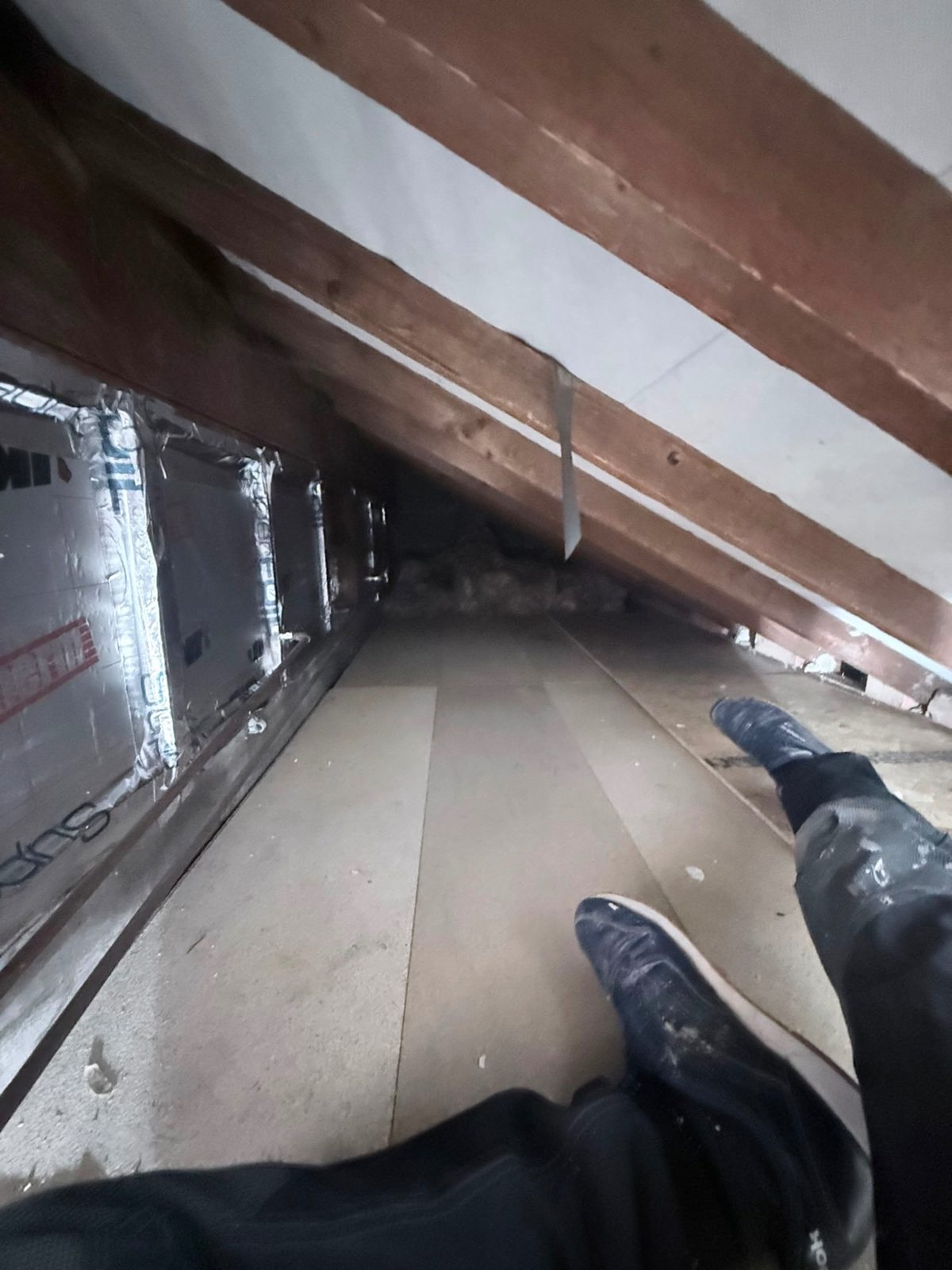 Foil-faced PIR insulation to roof of kitchen extension viewed from bedroom eaves crawl space, Bradford BD4