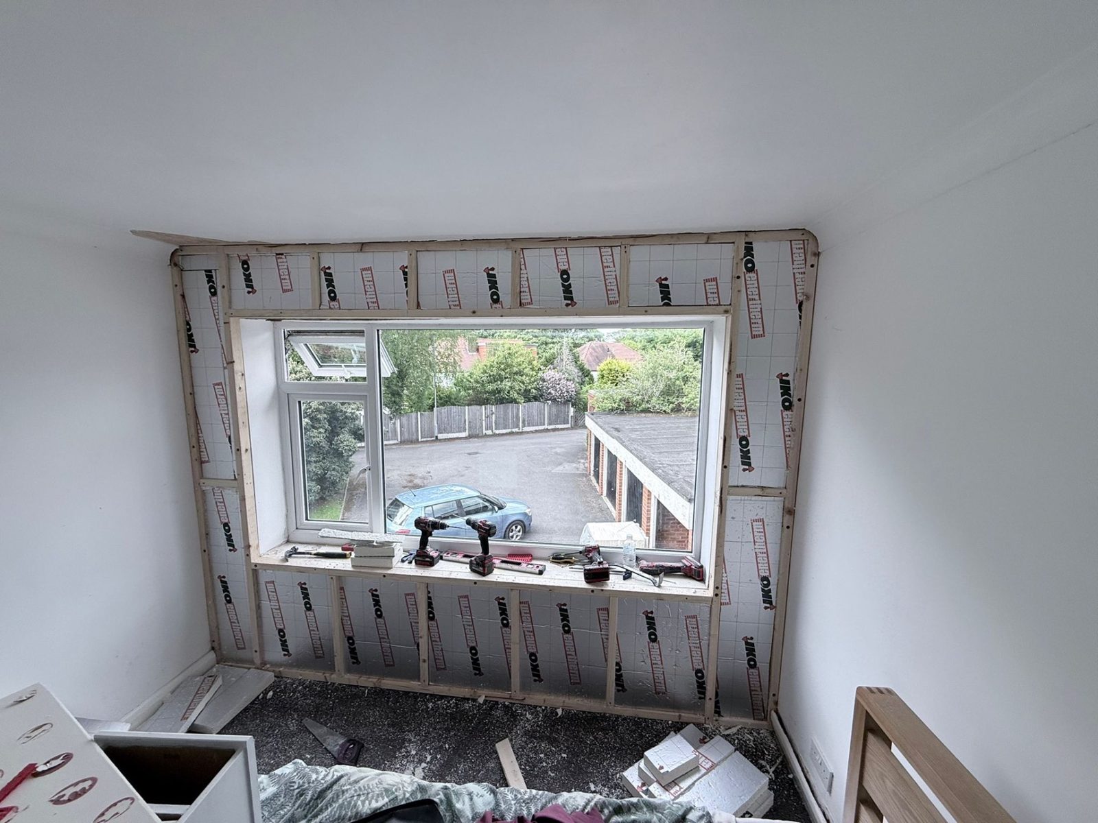 PIR insulation neatly cut around bay window reveals on Wyncliffe Court IWI job